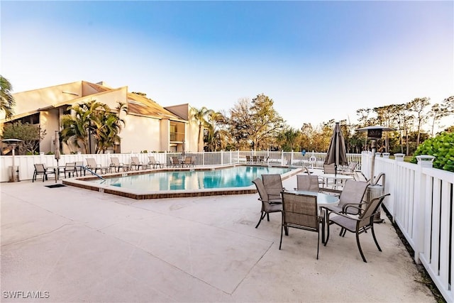 view of swimming pool featuring a patio