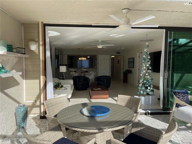 interior space with ceiling fan and an outdoor living space