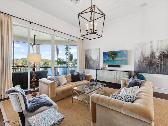 living room with an inviting chandelier, ornamental molding, and wood-type flooring