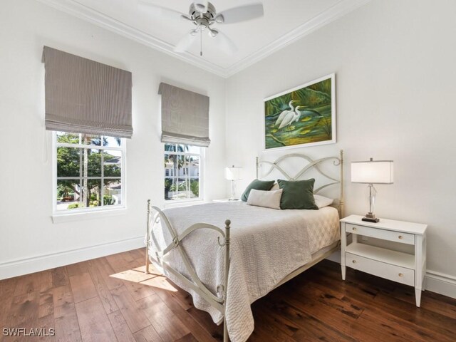 bedroom with crown molding, ceiling fan, dark hardwood / wood-style floors, and multiple windows