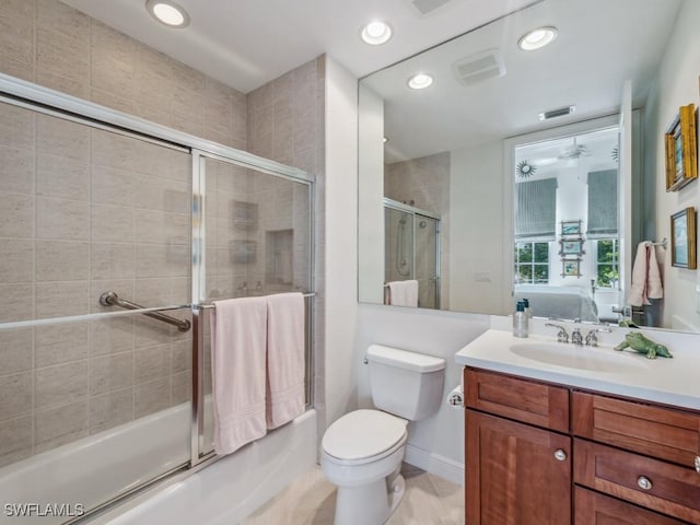 full bathroom with vanity, enclosed tub / shower combo, and toilet