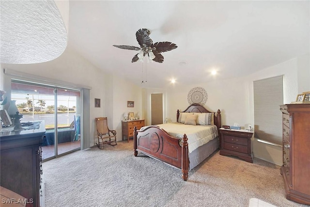 carpeted bedroom with access to exterior, ceiling fan, and lofted ceiling