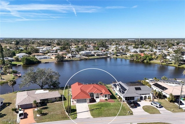 birds eye view of property featuring a water view