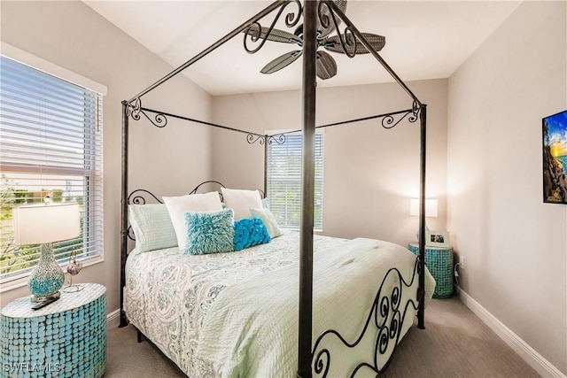 carpeted bedroom featuring ceiling fan