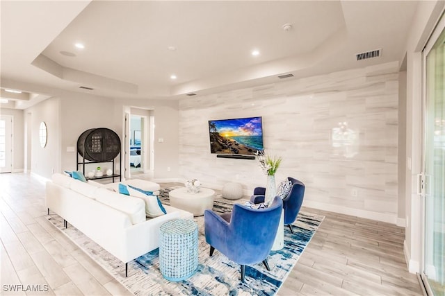 living room with a tray ceiling