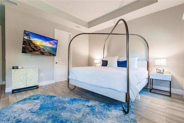 bedroom featuring hardwood / wood-style floors