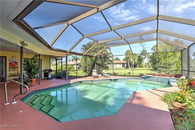 view of swimming pool with glass enclosure, a patio area, and grilling area