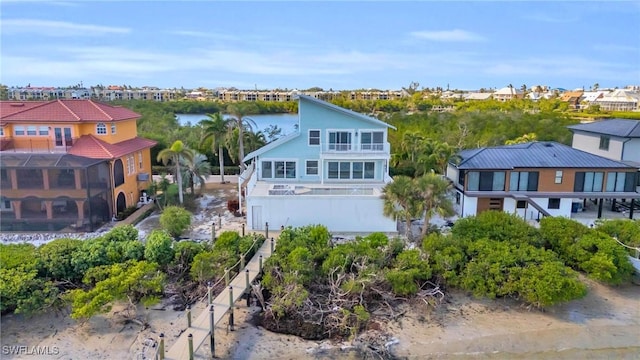 bird's eye view featuring a water view and a residential view