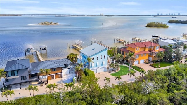 birds eye view of property featuring a water view