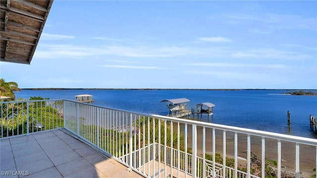 balcony featuring a water view