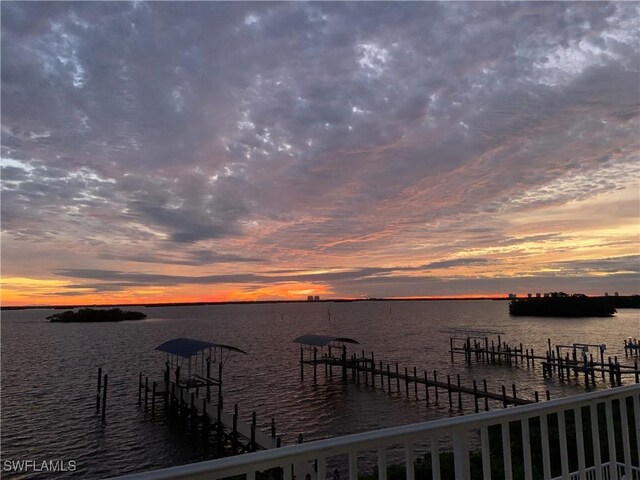 property view of water featuring a boat dock