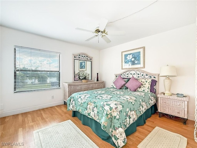 bedroom featuring ceiling fan and hardwood / wood-style flooring