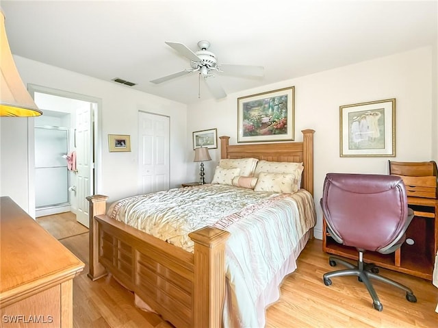 13276 White Marsh Ln Unit 3524, Fort Myers, FL 33912 - bedroom with light wood-type flooring, a closet, ensuite bath, and a ceiling fan