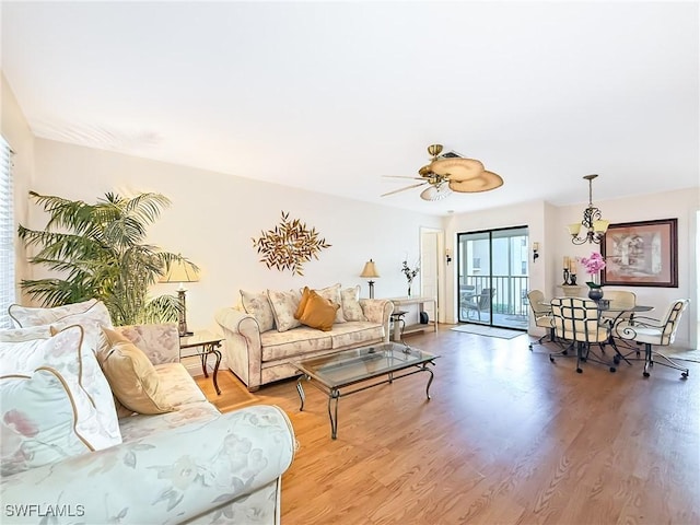 living room with ceiling fan and wood-type flooring