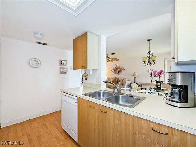 13276 White Marsh Ln Unit 3524, Fort Myers, FL 33912 - kitchen with dishwasher, light countertops, light wood-style floors, and pendant lighting
