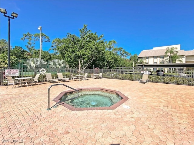 13276 White Marsh Ln Unit 3524, Fort Myers, FL 33912 - view of swimming pool with a community hot tub and a patio