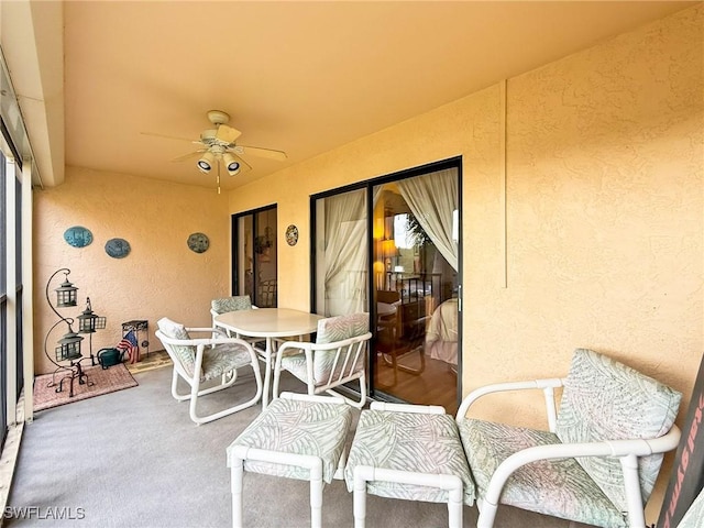 view of patio featuring ceiling fan