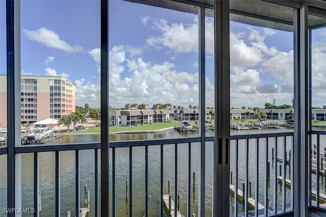 unfurnished sunroom with a water view