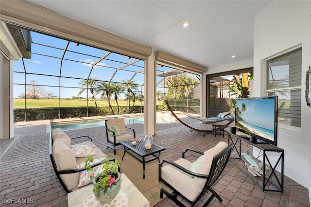 view of patio featuring an outdoor hangout area and a lanai