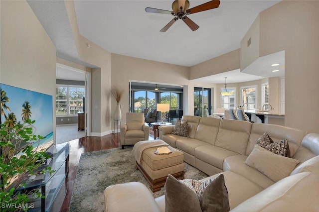 living room featuring hardwood / wood-style flooring, a wealth of natural light, and ceiling fan