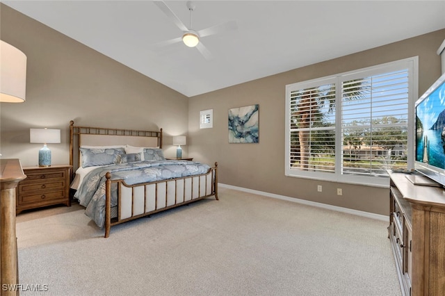 carpeted bedroom featuring a ceiling fan, lofted ceiling, and baseboards