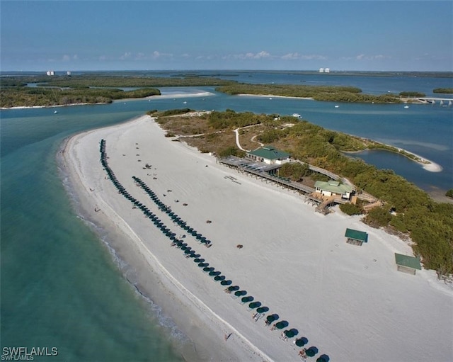 bird's eye view featuring a water view and a view of the beach