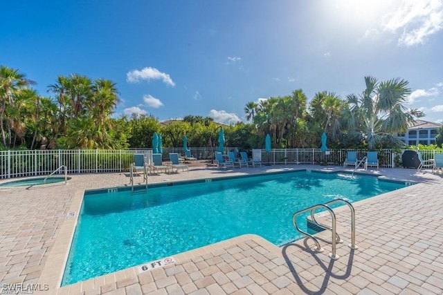 pool featuring a patio area and fence