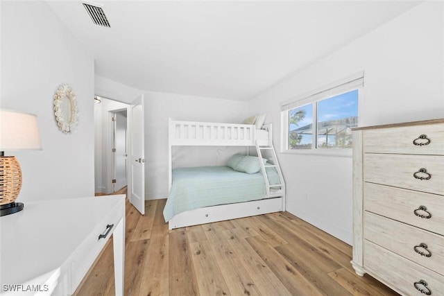 bedroom with light wood-type flooring