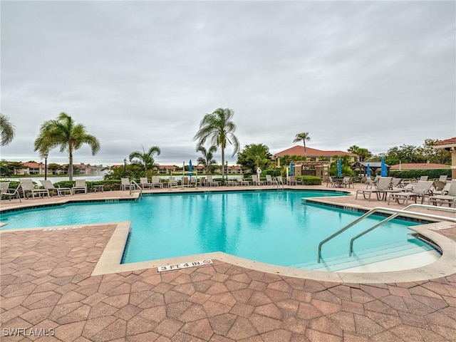 view of swimming pool featuring a patio area