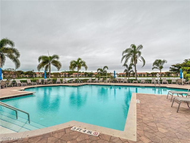 view of swimming pool with a patio area