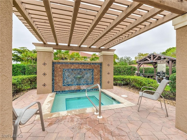 view of swimming pool with a pergola, a patio area, an in ground hot tub, and a gazebo