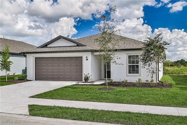 single story home with a front yard and a garage