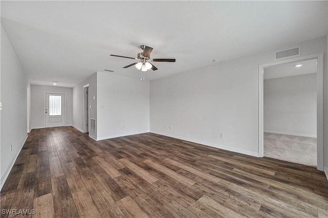 unfurnished room featuring ceiling fan and dark wood-type flooring