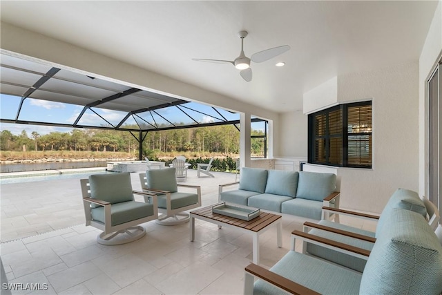 view of patio / terrace with glass enclosure, ceiling fan, and an outdoor hangout area