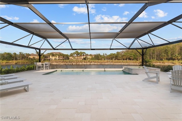 view of swimming pool with a lanai, a patio area, and a water view