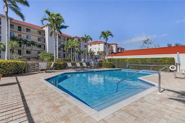 view of swimming pool featuring a patio area