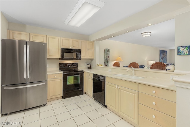 kitchen featuring kitchen peninsula, sink, light tile patterned floors, and black appliances