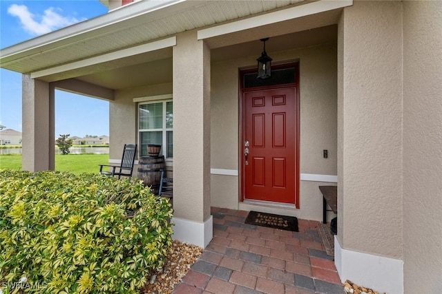 property entrance with covered porch