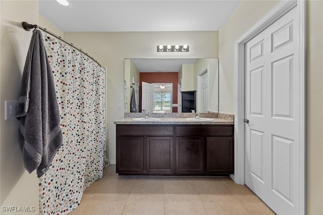 bathroom featuring tile patterned floors, a shower with curtain, and vanity