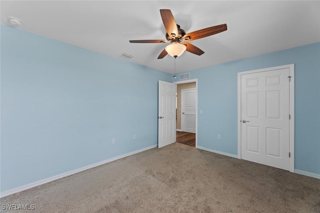 unfurnished bedroom with carpet flooring and ceiling fan