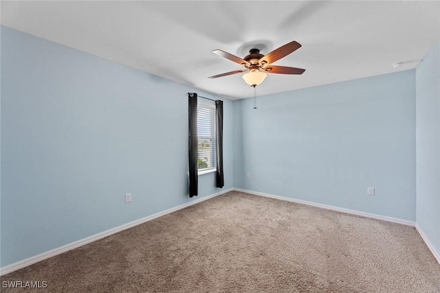 spare room with carpet flooring and ceiling fan