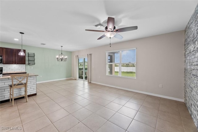 interior space with ceiling fan with notable chandelier and light tile patterned flooring