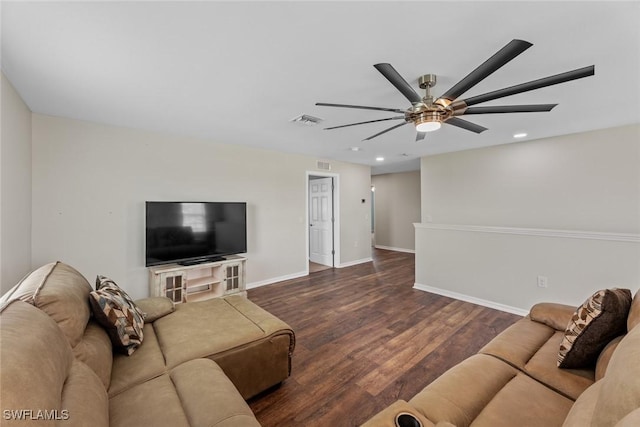 living room featuring ceiling fan and dark hardwood / wood-style floors