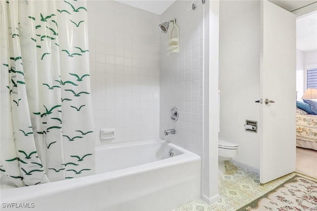 bathroom with shower / tub combo, baseboards, toilet, ensuite bathroom, and tile patterned flooring