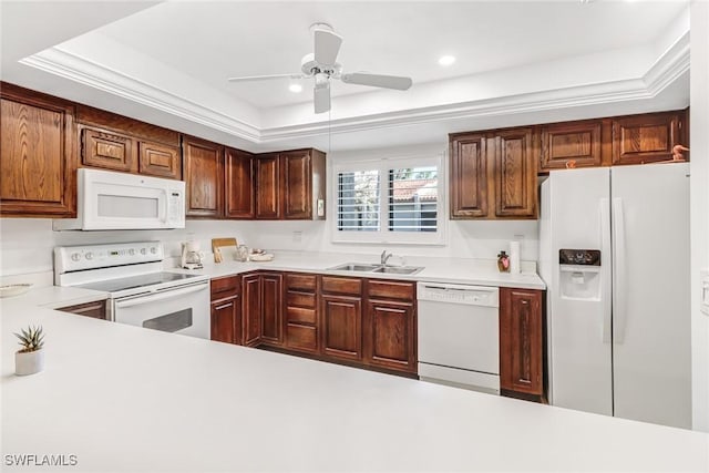 kitchen featuring recessed lighting, light countertops, a sink, ceiling fan, and white appliances