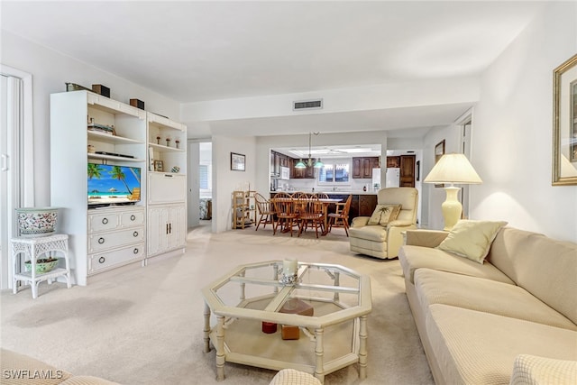 living area with carpet and visible vents