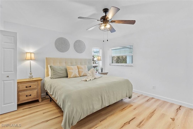 bedroom with ceiling fan and light wood-type flooring