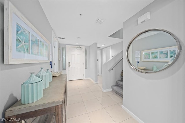 foyer with light tile patterned flooring