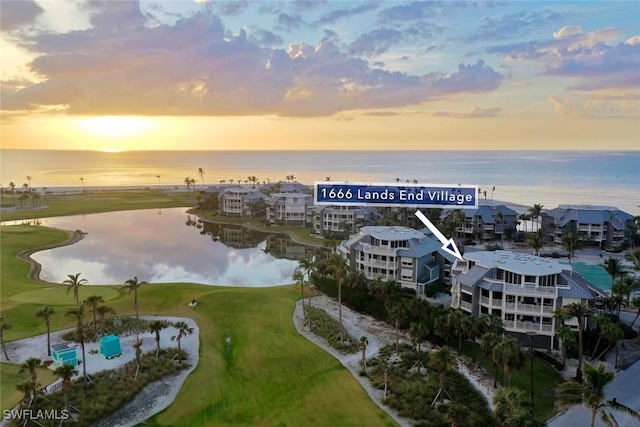 aerial view at dusk with a water view