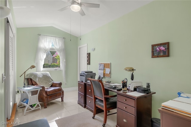 tiled home office featuring ceiling fan and lofted ceiling